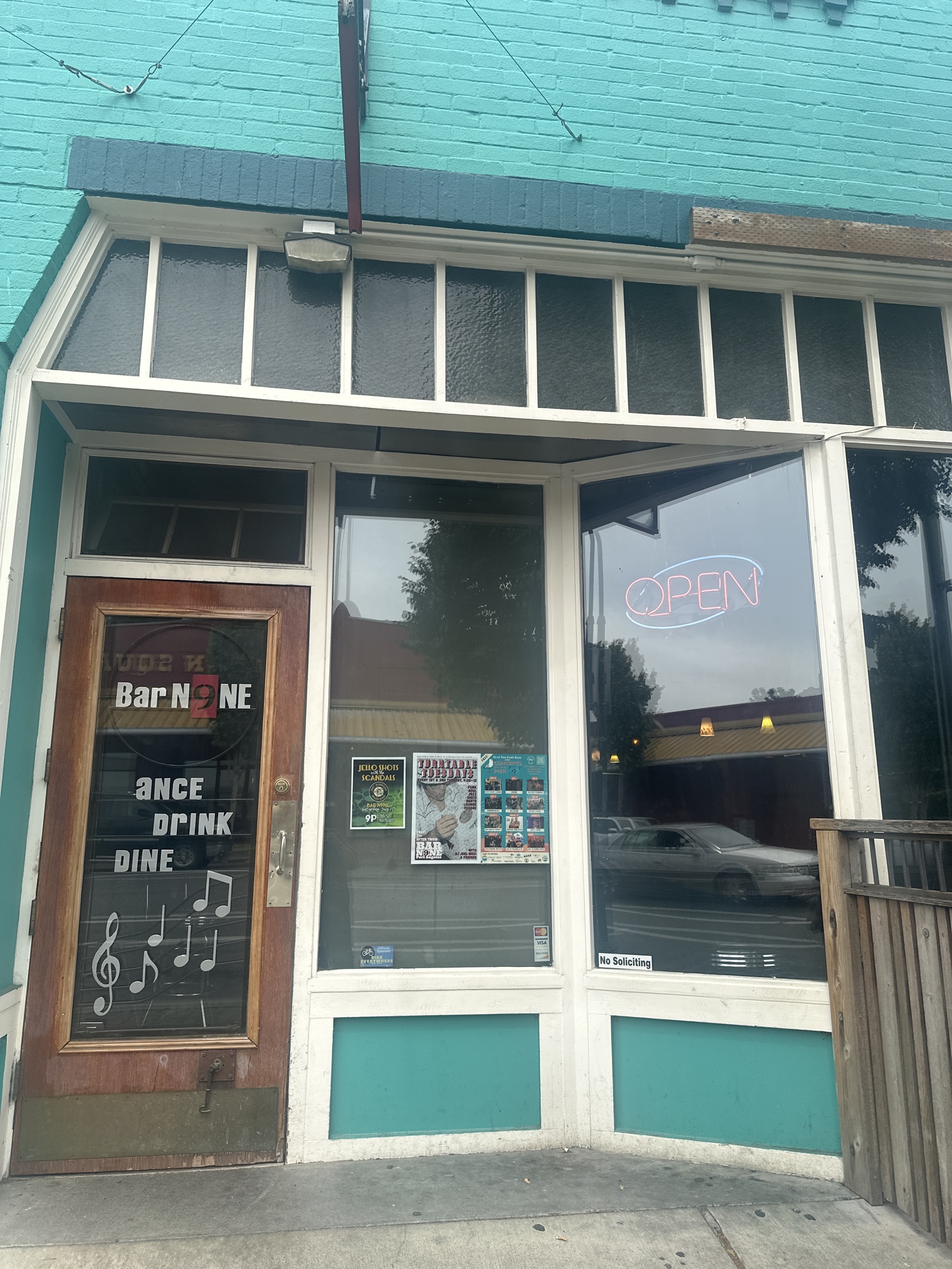 The front entrance of Bar N9NE in Port Angeles, WA — teal storefront with red Bar N9NE signage